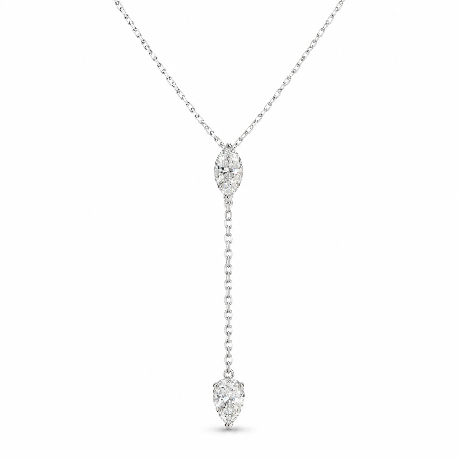Packshot of a diamond lariat necklace on pure white: a marquise diamond at the neck and a pear diamond at the end of the drop chain